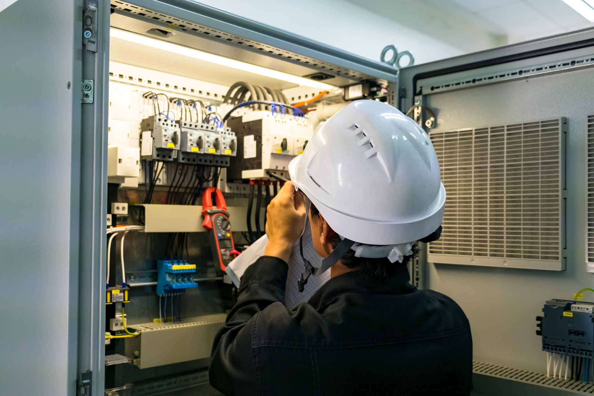 Industrial Electricial working on a hige fuseboard